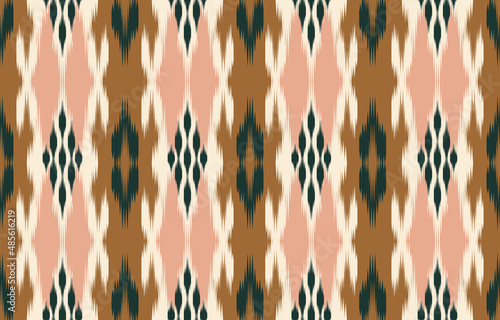 Brown ethnic abstract ikat art. Seamless pattern in tribal, folk embroidery, Cute Mexican style. Aztec geometric art ornament print. Design for carpet, wallpaper, clothing, wrapping, fabric, cover.