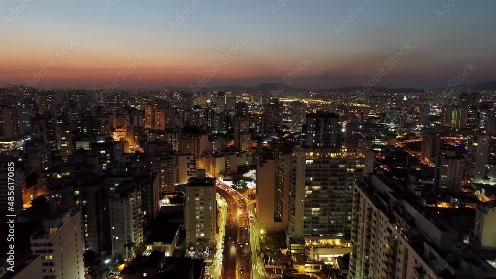 Sunset downtown Sao Paulo Brazil. Downtown district at sunset scenery. Metropolis landscape of landmark city. Sunset downtown Sao Paulo Brazil. Downtown district at sunset scenery. Metropolis landscape of landmark city.
