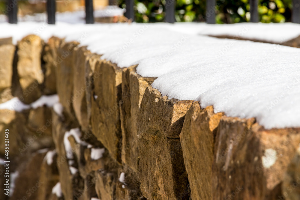 stone wall with snow on top stone wall with snow on top