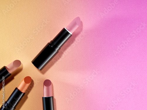 Creative pattern fashion photo of cosmetics beauty products lipsticks