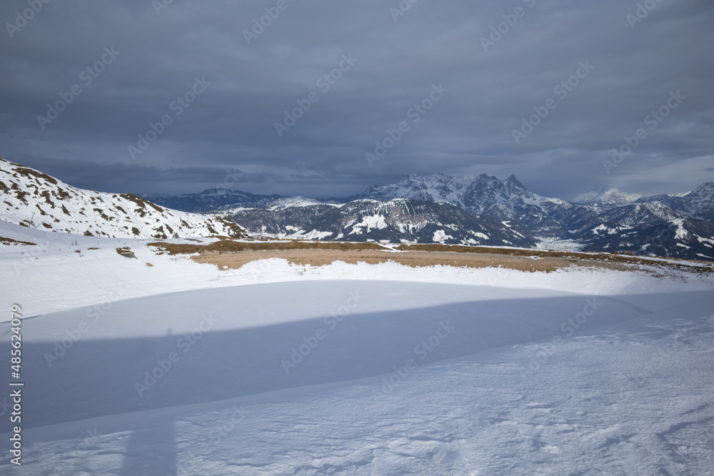 Kirchberg, Austria - December 26, 2021: Ski resort Kitzski in the Alps. Mountain snow peaks, skiers in equipment
