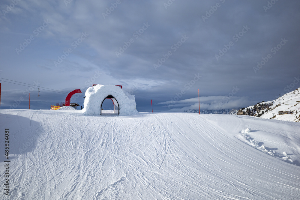Kirchberg, Austria - December 26, 2021: Ski resort Kitzski in the Alps. Mountain snow peaks, skiers in equipment
