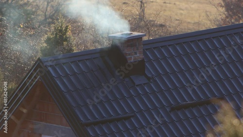 Footage of a houses chimney in full working process