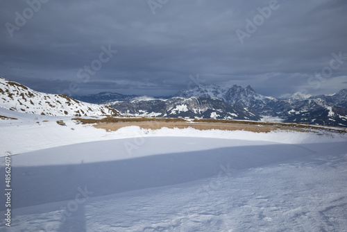 Obraz na płótnie Kirchberg, Austria - December 26, 2021: Ski resort Kitzski in the Alps. Mountain snow peaks, skiers in equipment w salonie