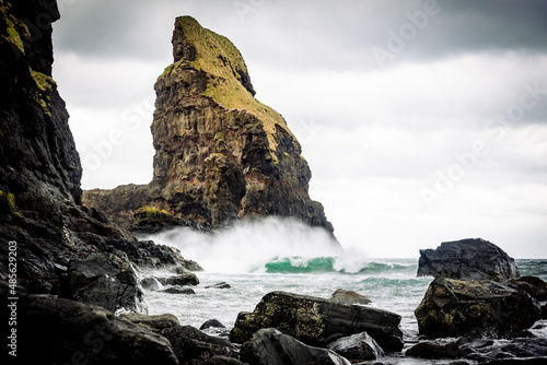 waves crashing into the rocks in talisker bay photo