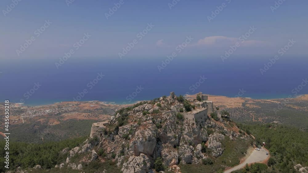 Aerial 4K landscape view of medieval Kantara Castle which is located at the Mountains in North Cyprus. Medieval Castle is surrounded with rocks & trees with an amazing view of Mediterranean Sea. Aerial 4K landscape view of medieval Kantara Castle which is located at the Mountains in North Cyprus. Medieval Castle is surrounded with rocks & trees with an amazing view of Mediterranean Sea.
