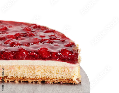 Slice of Red fruit sponge cake on plate.