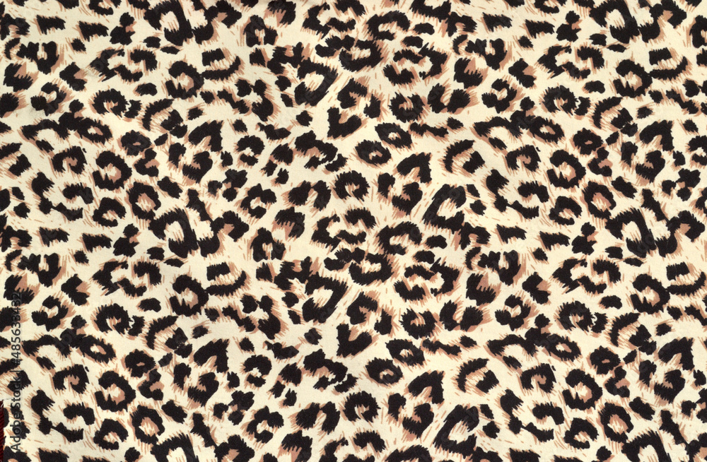 Leopard print on thin, mass-produced silk fabric. Abstract animal skin pattern, background Leopard print on thin, mass-produced silk fabric. Abstract animal skin pattern, background