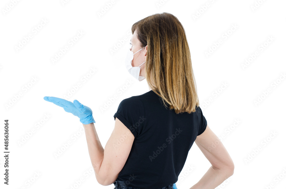 Back view of woman confusing. Young shocked woman with hand up. Rear view of young woman with face mask and blue gloves with hand up, Isolated on white background. 2019-nCov. Back view of woman confusing. Young shocked woman with hand up. Rear view of young woman with face mask and blue gloves with hand up, Isolated on white background. 2019-nCov.