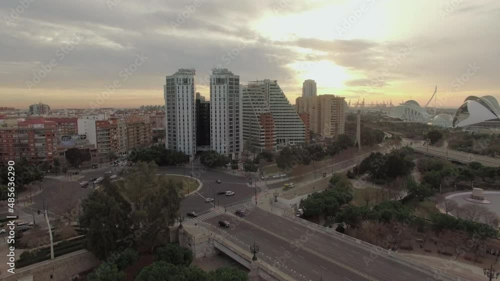 Flying over Valencia at sunset, Spain. Cityscape with bridge and buildings Flying over Valencia at sunset, Spain. Cityscape with bridge and buildings