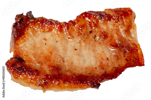 Grilled meat texture closeup isolated on white. A fatty piece of pork at a large approximation. Harm from meat fried in oil.