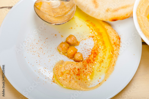 Hummus with pita bread photo