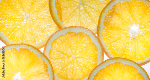 Yellow orange rings on a white light background. Background with citrus fruits.