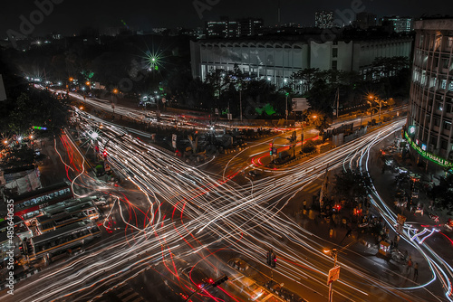 Aerial view of a busy junction street at night in Dhaka, Bangladesh. photo