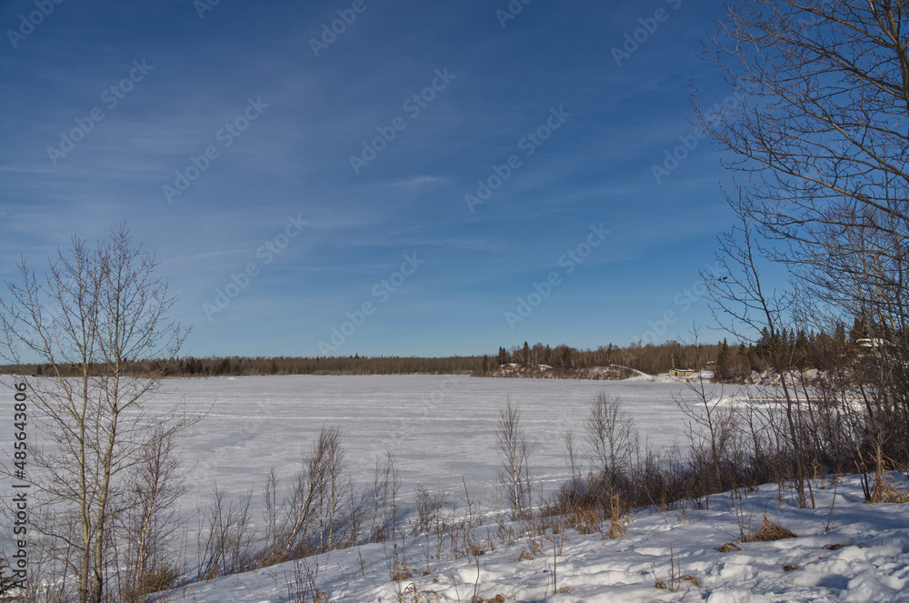 Frozen Astotin Lake on a Partially Cloudy Winter Day