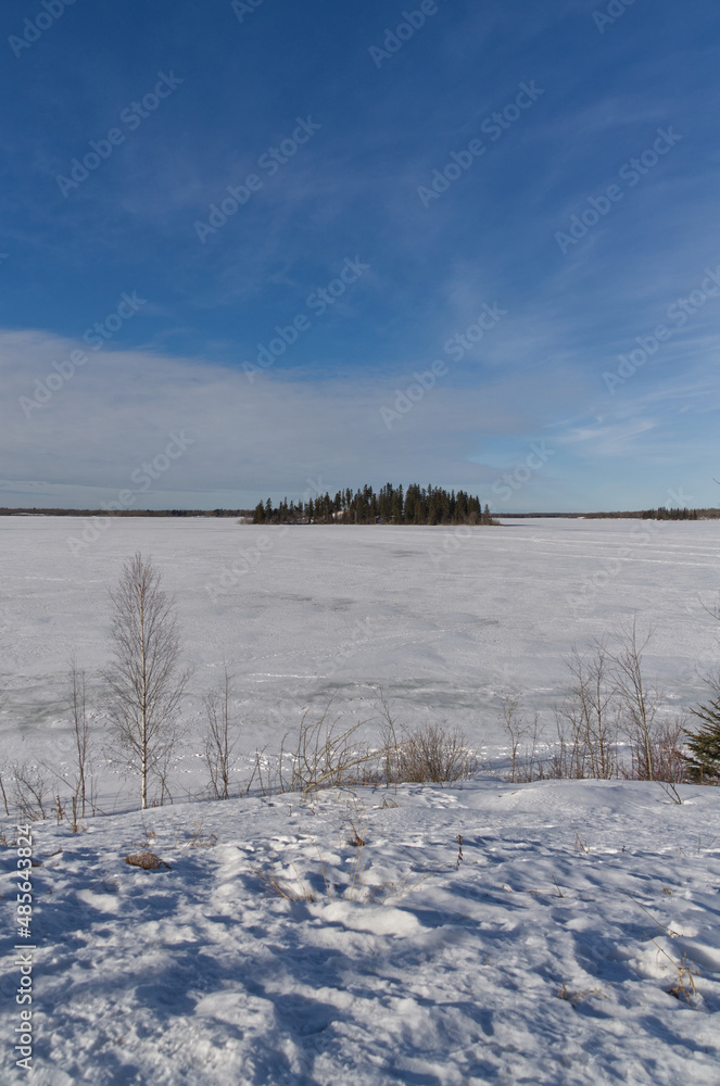 Frozen Astotin Lake on a Partially Cloudy Winter Day Frozen Astotin Lake on a Partially Cloudy Winter Day