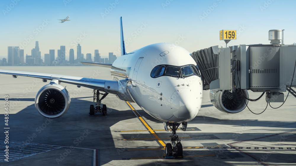 modern airliner at the terminal of an airport modern airliner at the terminal of an airport