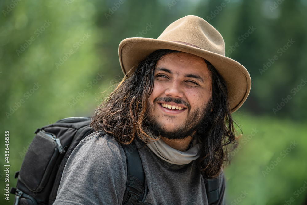 A young hispanic man hiking