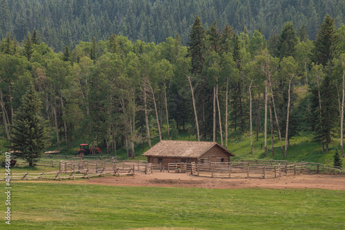 a cabin by a forest in the west photo