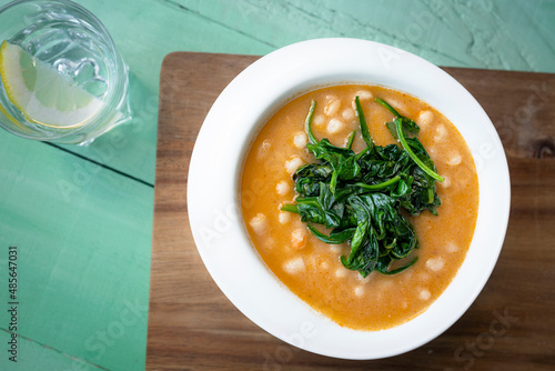 White beans with spinach. Legumes and vegetables. Healthy dish with vegan protein. Plant based food.