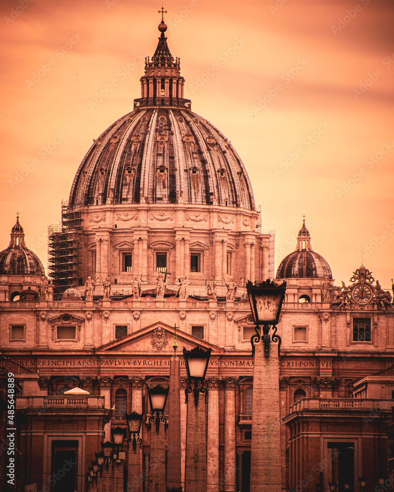 Dome of Saint Peter's cathedral basking in sunset, Rome, Italy. 