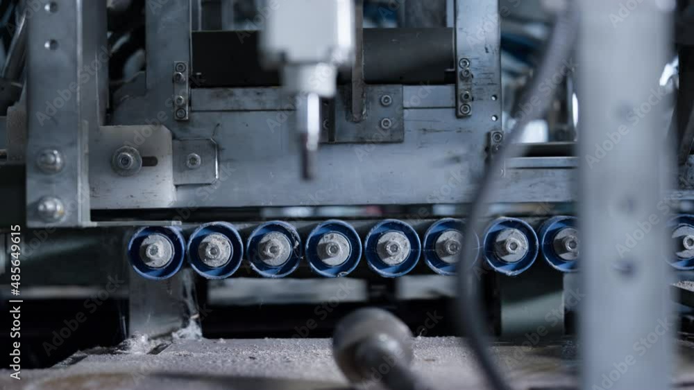 Closeup conveyor belt mechanism working at manufacture moving production Closeup conveyor belt mechanism working at manufacture moving production