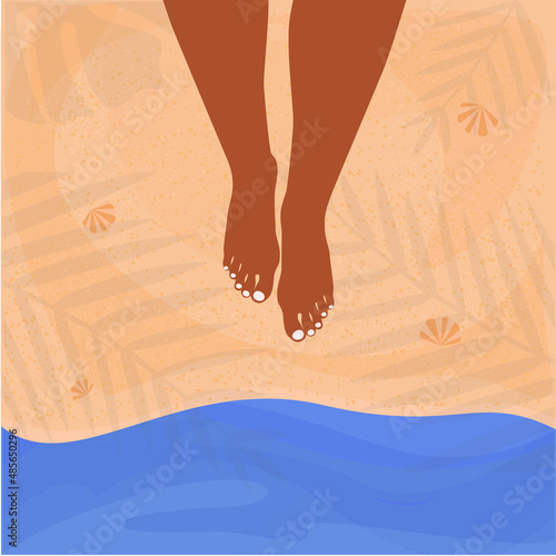 Women's tanned legs. The lady is standing by the water