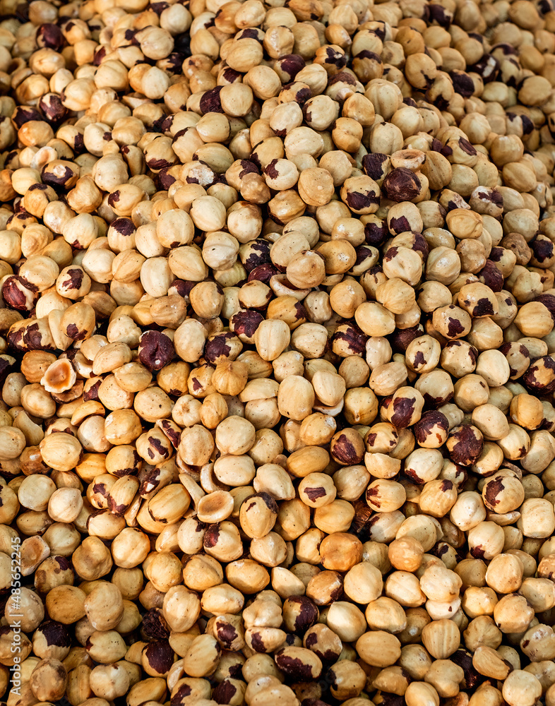 Dried and roasted hazelnuts background Dried and roasted hazelnuts background