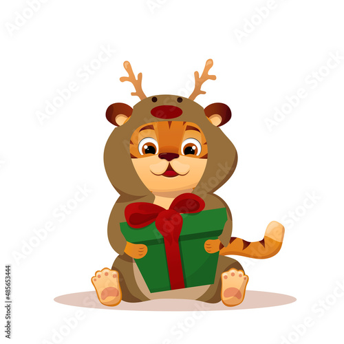 Cartoon festive little tiger dressed as a deer sitting and holding a gift in a box with a bow. Year of the Chinese Tiger.