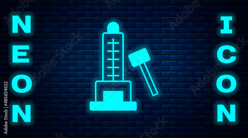 Glowing neon High striker attraction with big hammer icon isolated on brick wall background. Attraction for measuring strength. Amusement park. Vector