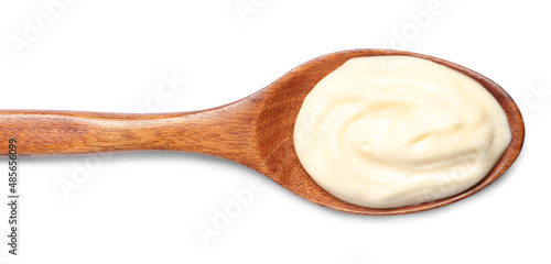 Wooden spoon with mayonnaise isolated on white, top view