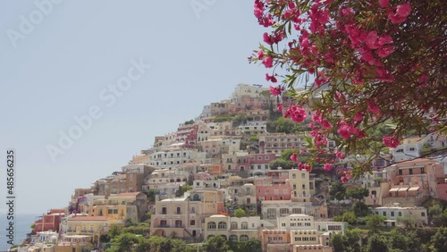 A panoramic view of the Positano on the Amalfi Coast, Italy. Sunny day, coastline, cliff, sea, boats, beautiful day, scenic, Italian architecture, gimbal camera move - 4K Video Footage