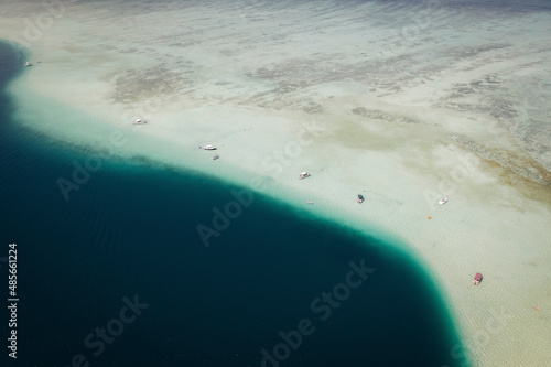 Aerial view of Kaneohe Sandbar with boats anchored along Ahu Olaka island, Kaualuu, Hawaii, United States. photo