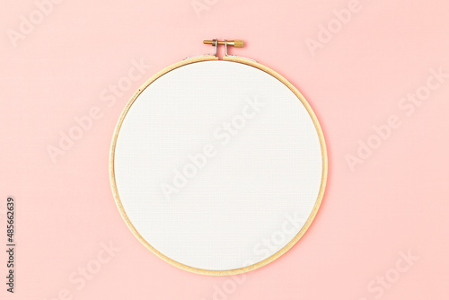 Hoop for embroidery on a pink background photo