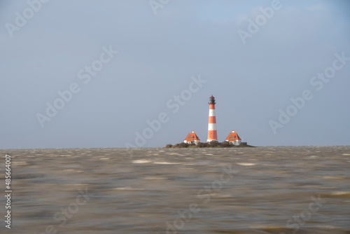 a beautiful lighthouse on the North Sea during storm tide