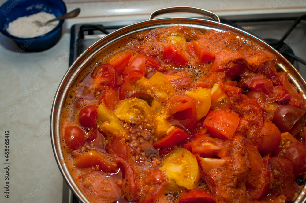 Cooking tomato ketchup in a bowl Cooking tomato ketchup in a bowl