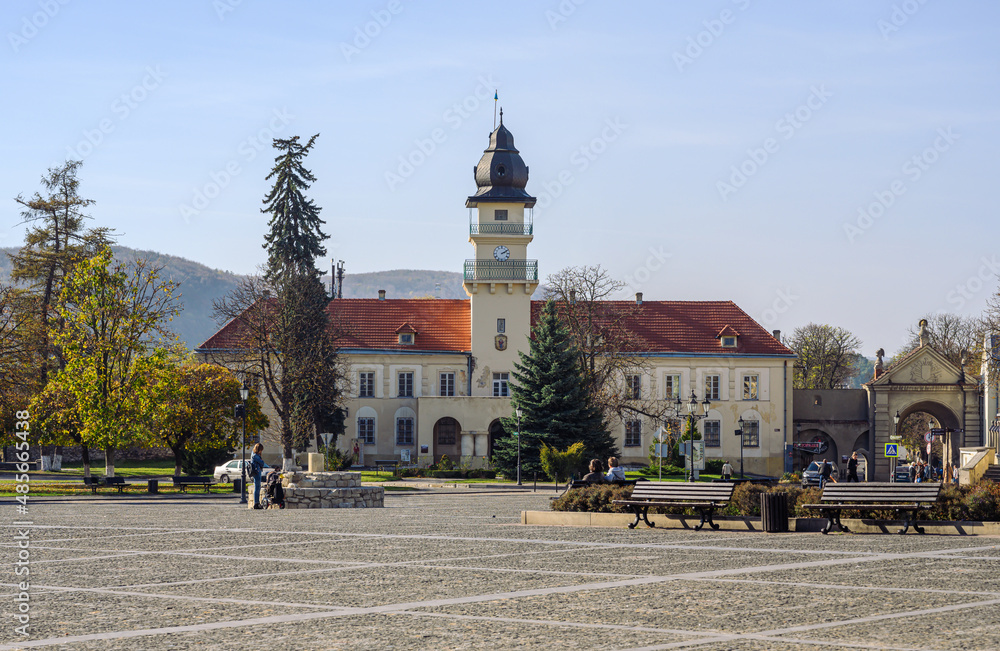 Square and ancient town hall with clock tower in Zhovkva, Lviv region, Ukraine