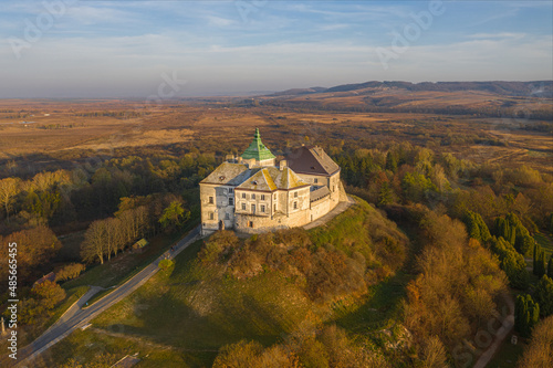 Olesko Palace from the air. Reserve. Autumn park on the hills. Aerial view of the Olesky Castle, Ukraine.