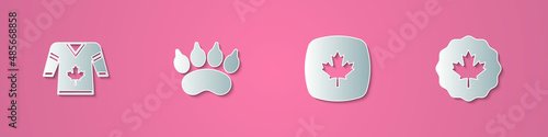 Set paper cut Hockey jersey, Bear paw footprint, Canadian maple leaf and icon. Paper art style. Vector