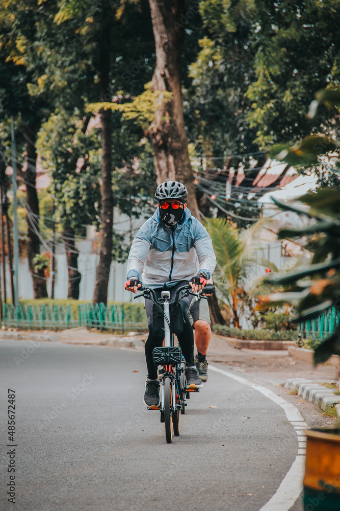 Fototapeta premium person riding a bike