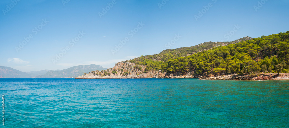 Mediterranean coast and turqouise blue sea water on Mediterranean Sea at Dalyan, Mugla Province, Turkey, Eastern Europe, background with copy space