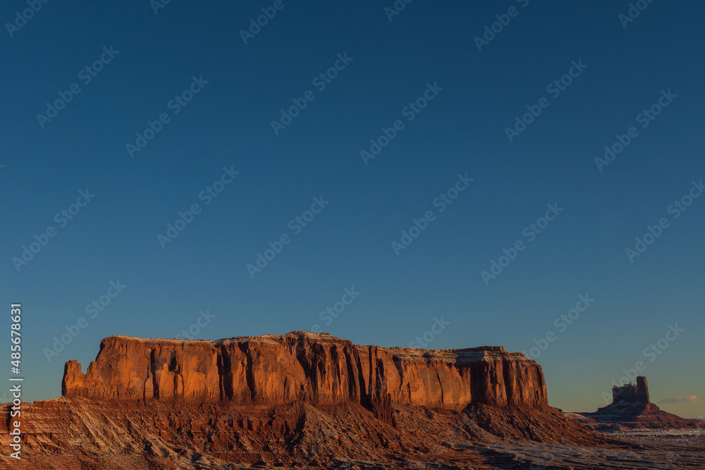 Naklejka premium Monument valley in the state of Utah, United States. Navajo Indian Reservation. Wild West. Travel and vacation concept. Reddish desert.