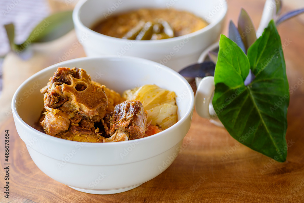 Rabada, oxtail traditional dish of Brazilian cuisine. Made with oxtail meat. Rabada, oxtail traditional dish of Brazilian cuisine. Made with oxtail meat.