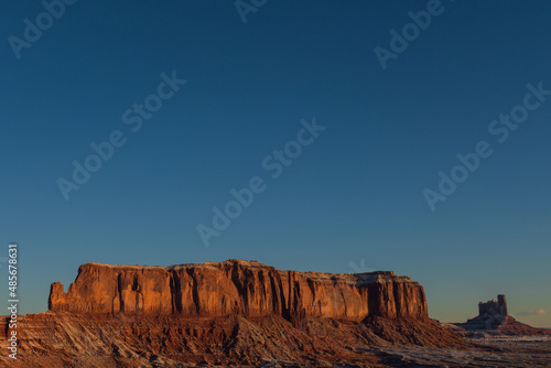 Monument valley in the state of Utah, United States. Navajo Indian Reservation. Wild West. Travel and vacation concept. Reddish desert.