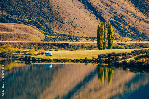 Lake Moke campsite, caravan reflections at dawn, Queenstown, South Island, New Zealand