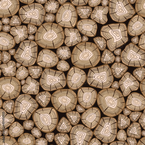 seamless pattern in the form of a stack of firewood with the image of the end sections of trees for interior decoration and background images