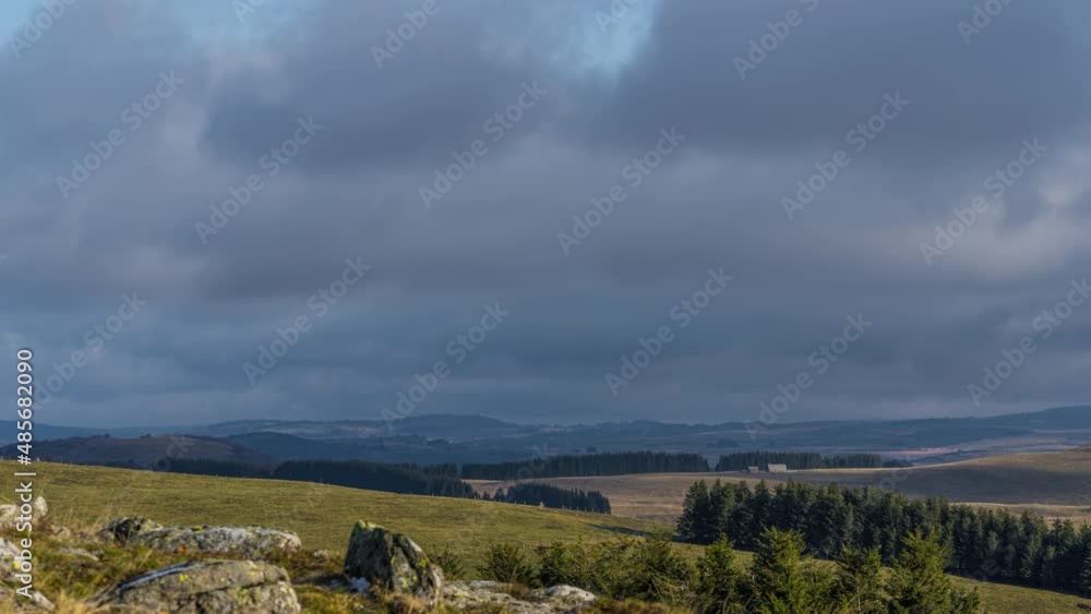 Cloudy Sky at Day Over a Wide and Desert Lowland in France Some Rocks in the Ground Cloudy Sky at Day Over a Wide and Desert Lowland in France Some Rocks in the Ground