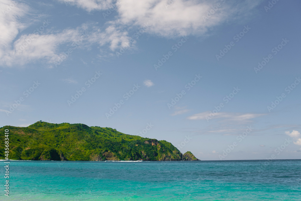 Crystal Clear Blue Ocean at Mawun Beach, a Tropical Paradise in the South of Lombok, Indonesia, Asia, background with copy space