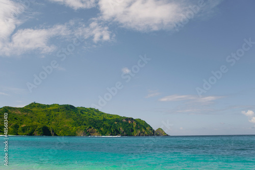 Fototapeta Naklejka Na Ścianę i Meble -  Crystal Clear Blue Ocean at Mawun Beach, a Tropical Paradise in the South of Lombok, Indonesia, Asia, background with copy space