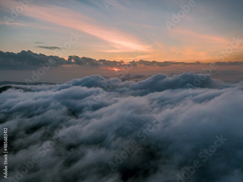 Aerial droen view of beautiful clouds with sunset in mountain